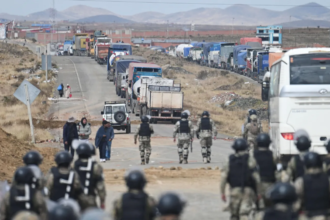 Bolivian minister's convoy ambushed while monitoring barricade removal