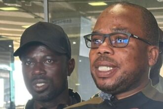 Emmanuel Asamoah (left) who came under xenophobic attacks in South Africa arrived in Accra on Tuesday, May 5, 2026, from Johannesburg, accompanied by the Ghana High Commissioner to South Africa, Benjamin Quarshie (right)