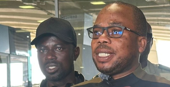 Emmanuel Asamoah (left) who came under xenophobic attacks in South Africa arrived in Accra on Tuesday, May 5, 2026, from Johannesburg, accompanied by the Ghana High Commissioner to South Africa, Benjamin Quarshie (right)
