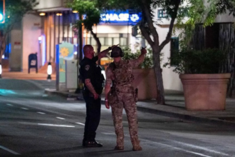 A man who took hostages at a California bank was shot and killed by the FBI.