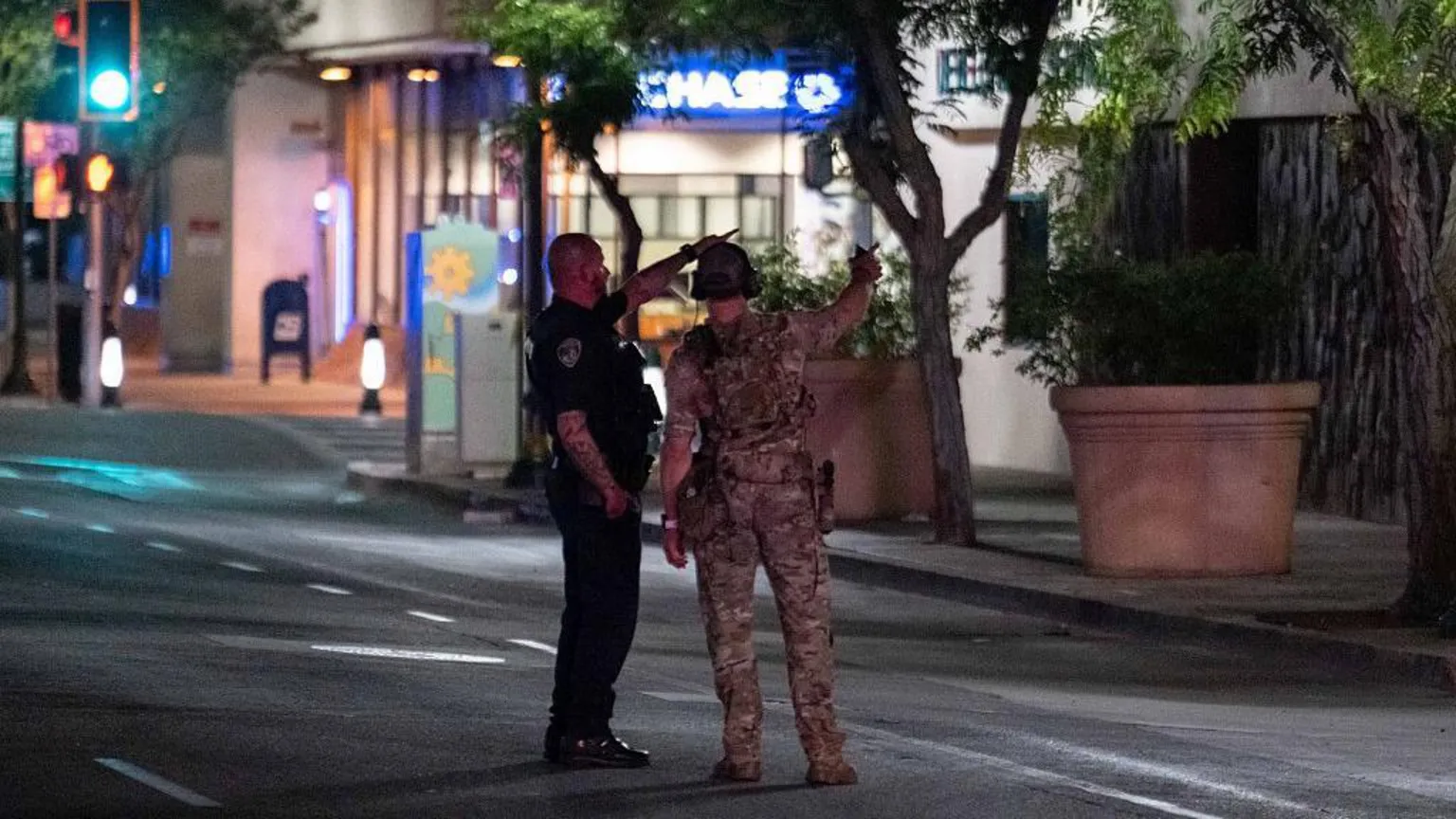 A man who took hostages at a California bank was shot and killed by the FBI.