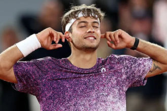 Cobolli takes advantage of Nadal's shower as he aims for French Open glory