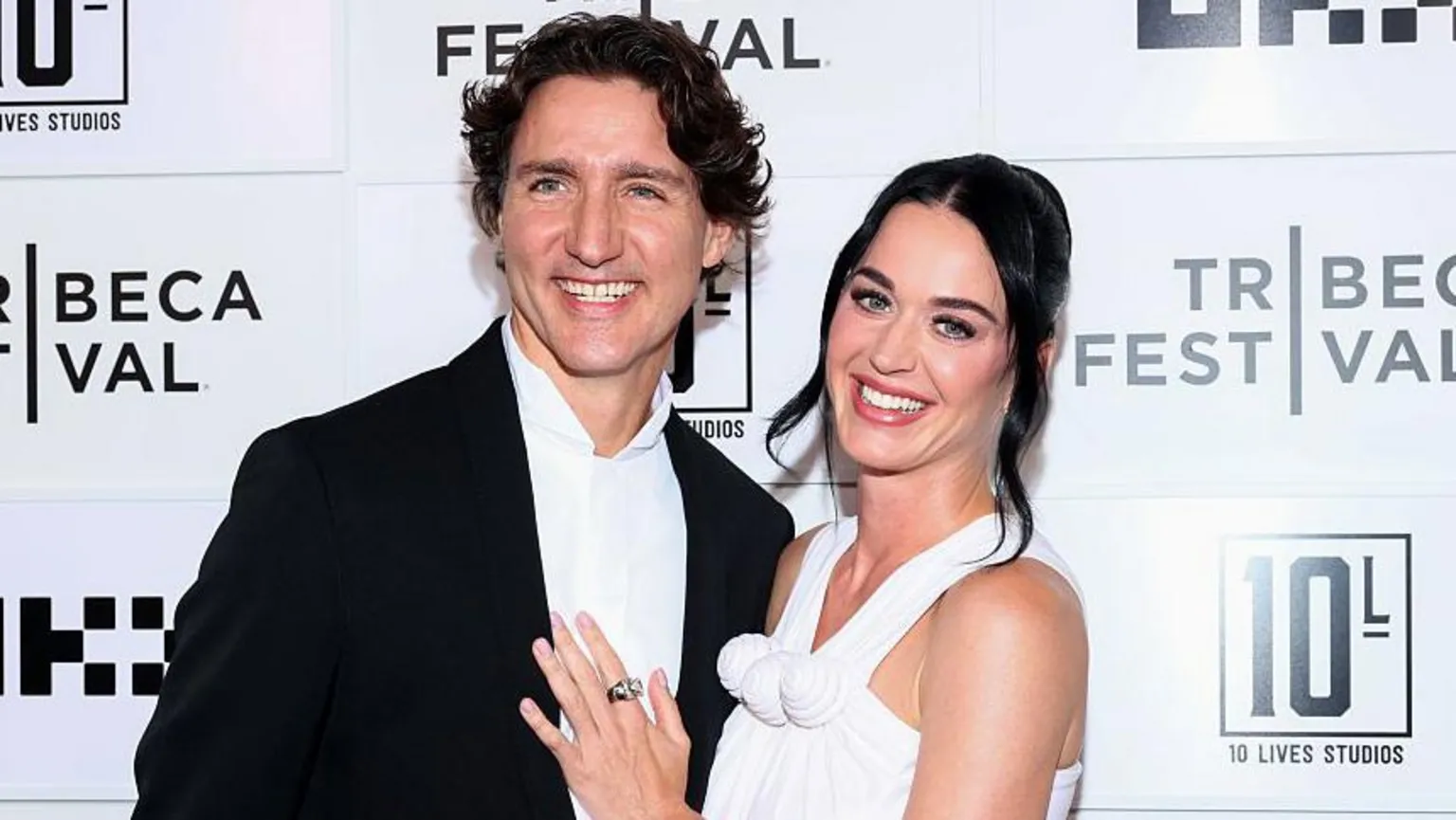 Prime Minister Trudeau says he has ``obligations to be a boyfriend'' after missing game against Canada to watch Perry